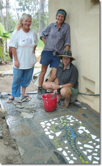 Trish, Phred and Val beside gecko mosaic
